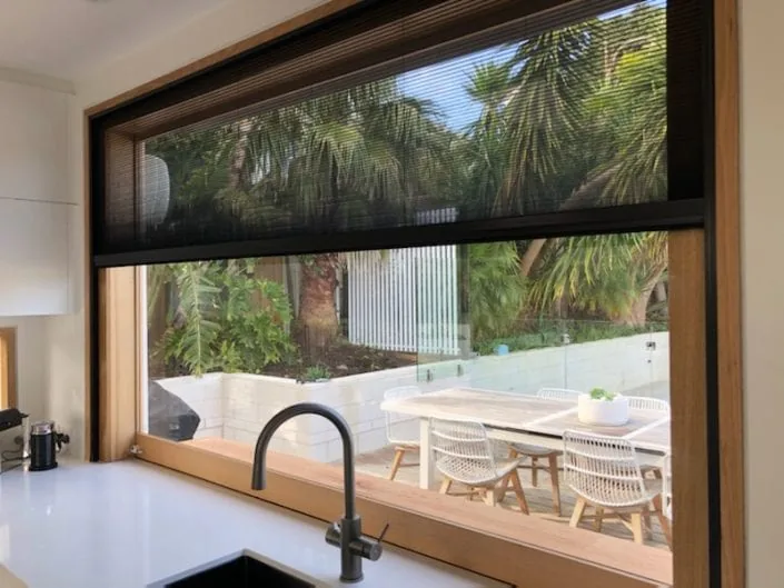 Retractable fly screen on window Melbourne — We Inspire Blinds