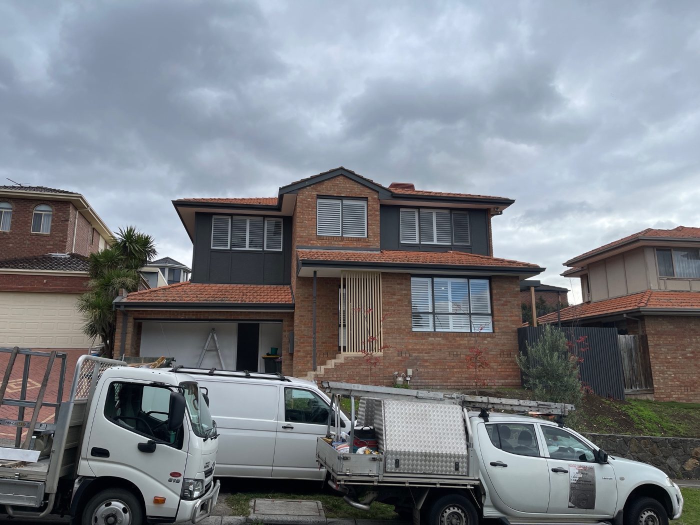 White plantation shutters framing the front exterior of a Melbourne residence