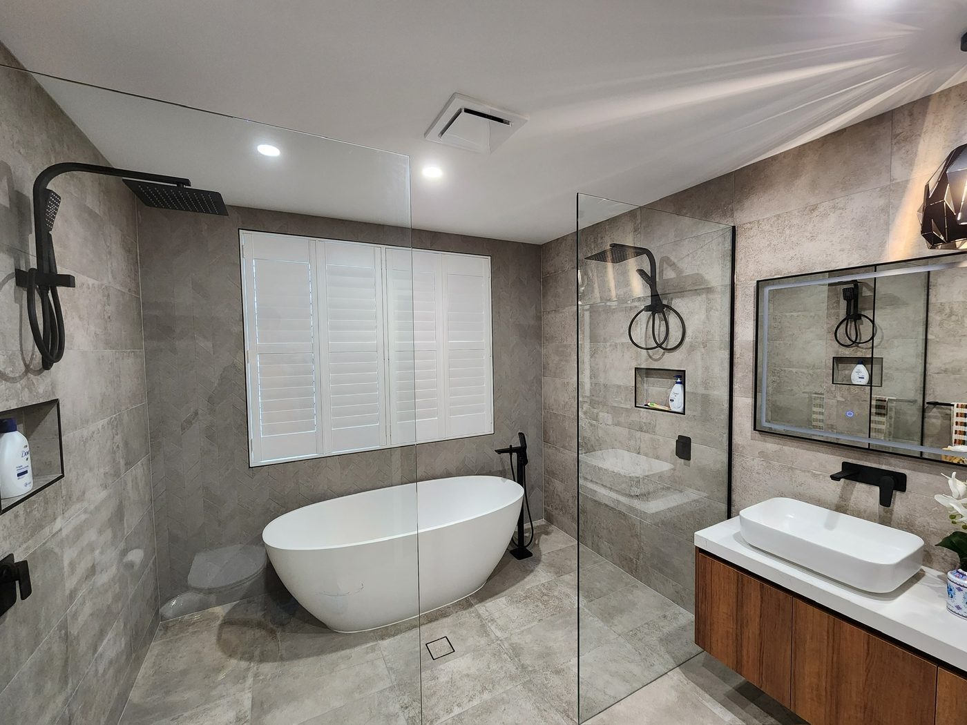 Plantation shutters in a bathroom — modern Melbourne home