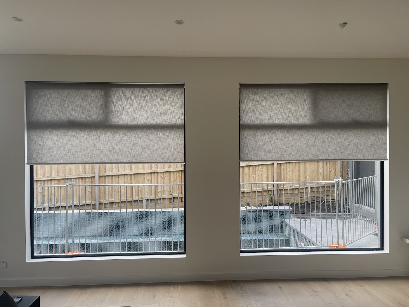 Light-filter roller blinds in a main living room — Melbourne home