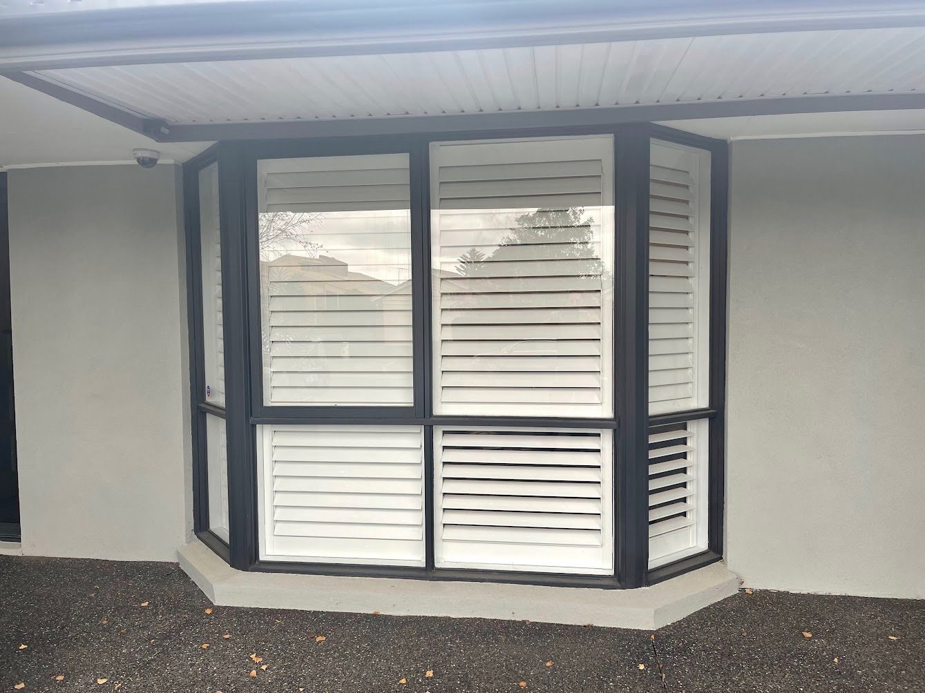 Timber-look plantation shutters on exterior windows, Melbourne