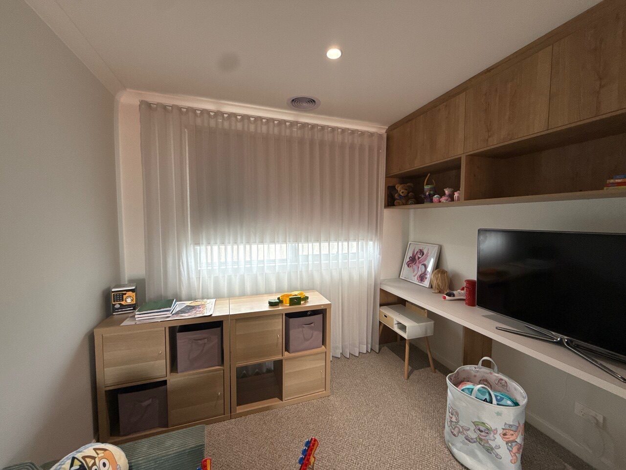Curtains and roller blinds paired in a Melbourne home office