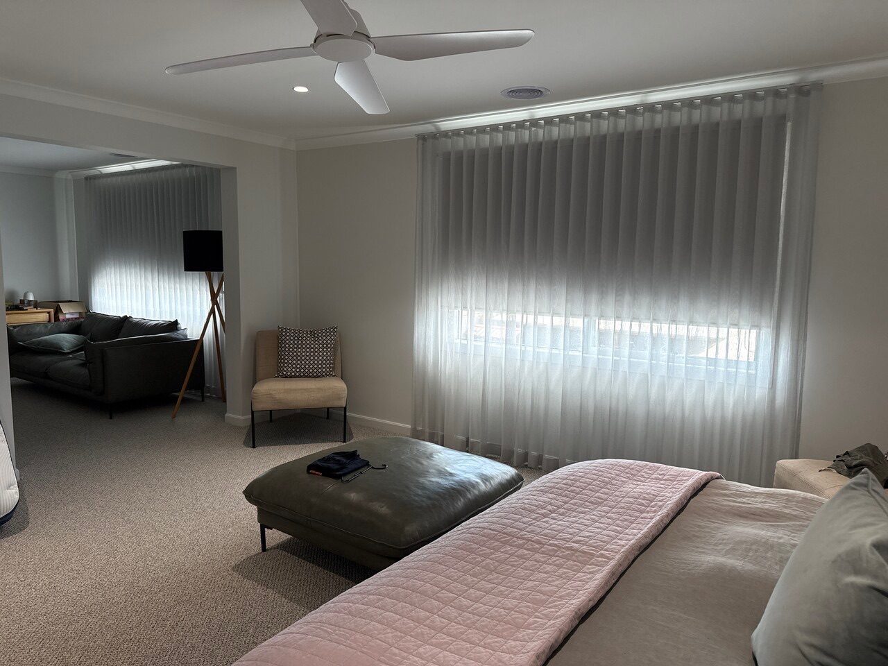 Light-filter roller blinds and linen curtains in a bedroom — Melbourne property