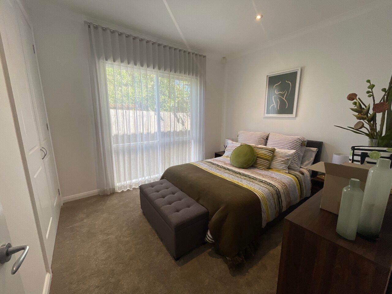 S-fold curtains and double roller blinds fitted in a main bedroom — Melbourne townhouse