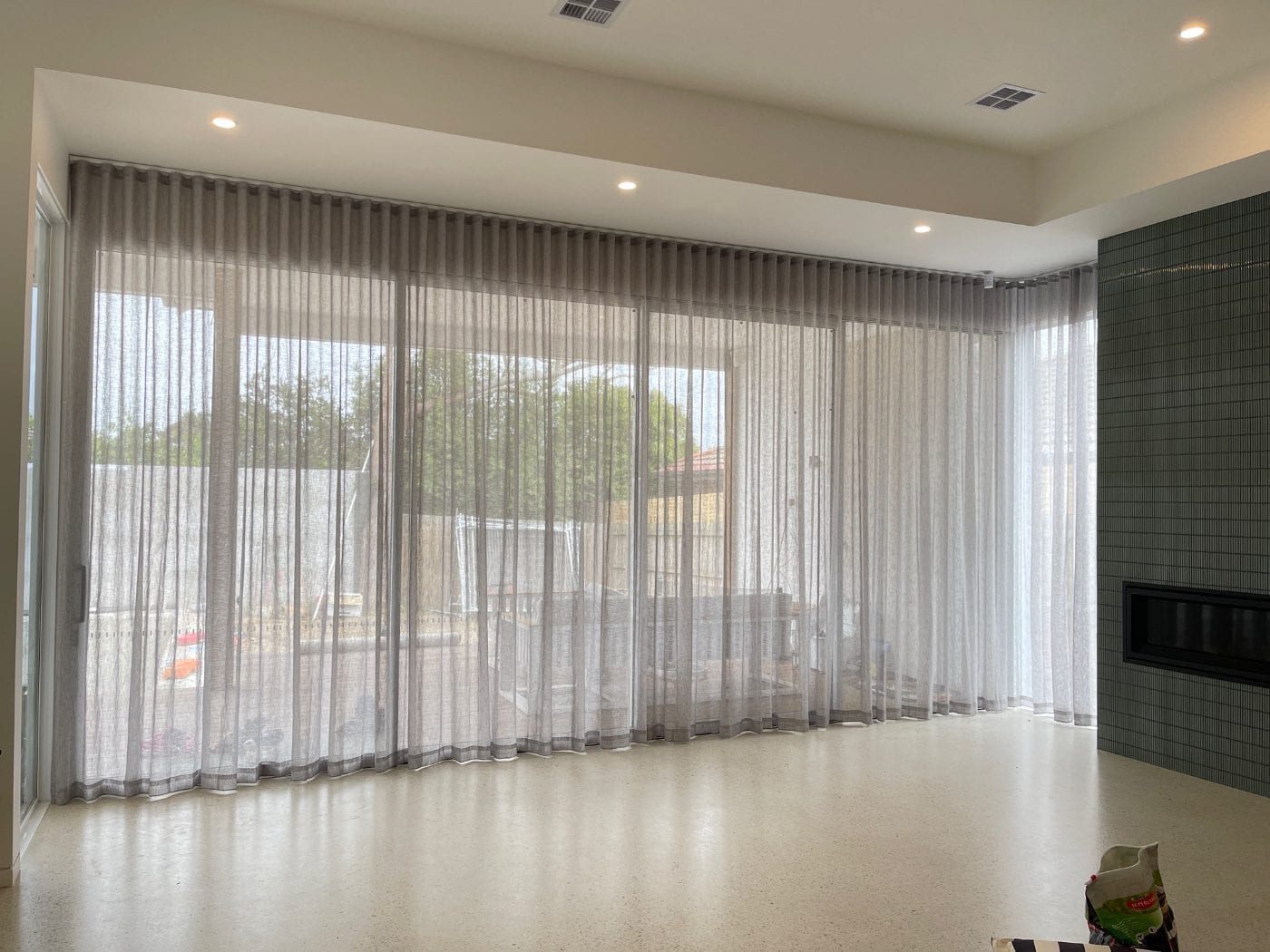 Flowing sheer curtains in a light-filled Melbourne living space