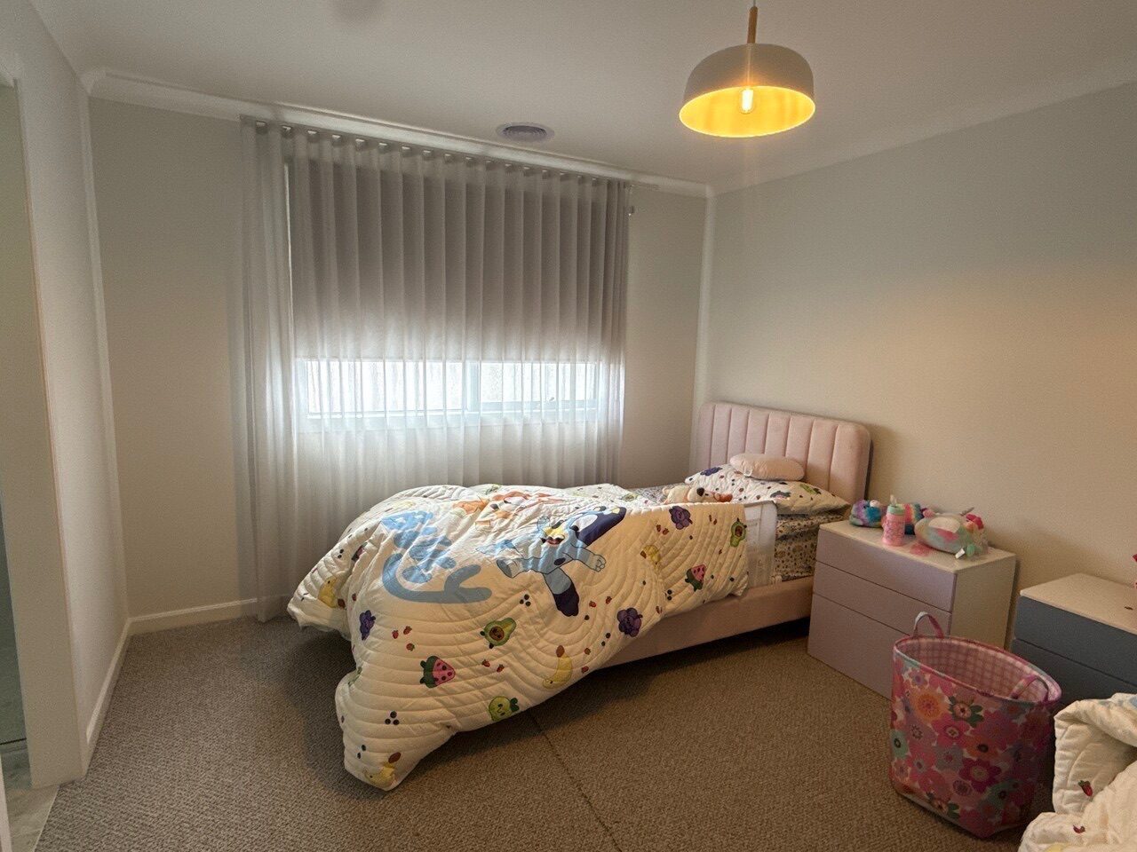 Custom roller blinds and custom curtains installed in a master bedroom — Melbourne residence