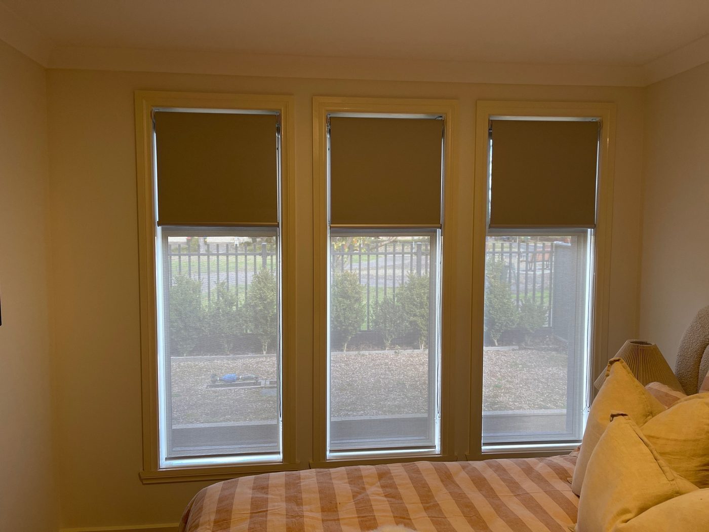 Blockout roller blinds fitted in a main bedroom — modern Melbourne home