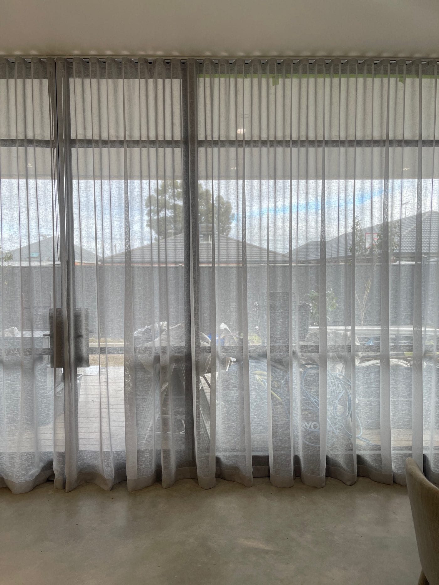 Double curtains with sheer and blockout in a Melbourne living room