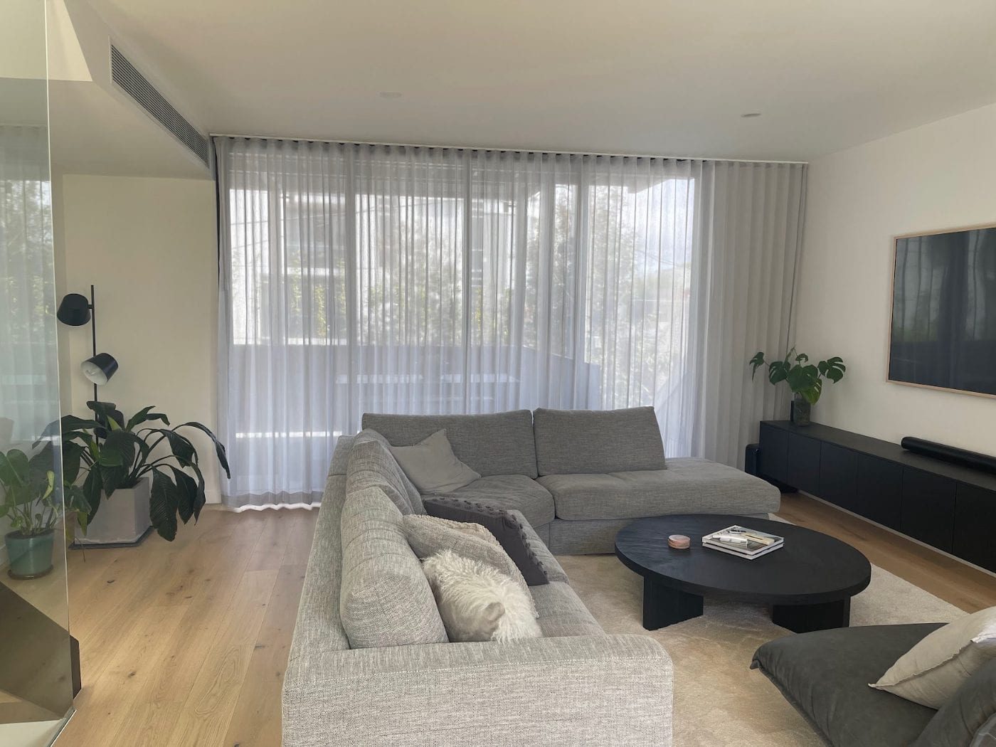 Pinch pleat curtains in an elegant Melbourne living room