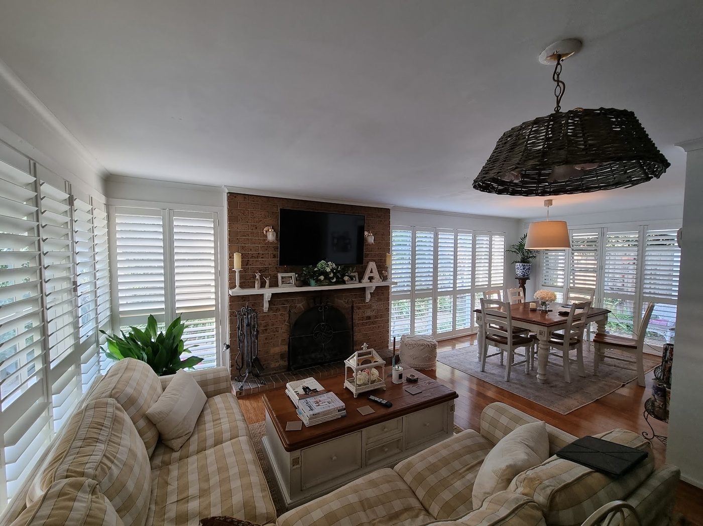 Custom plantation shutters installed in a lounge room — Melbourne townhouse
