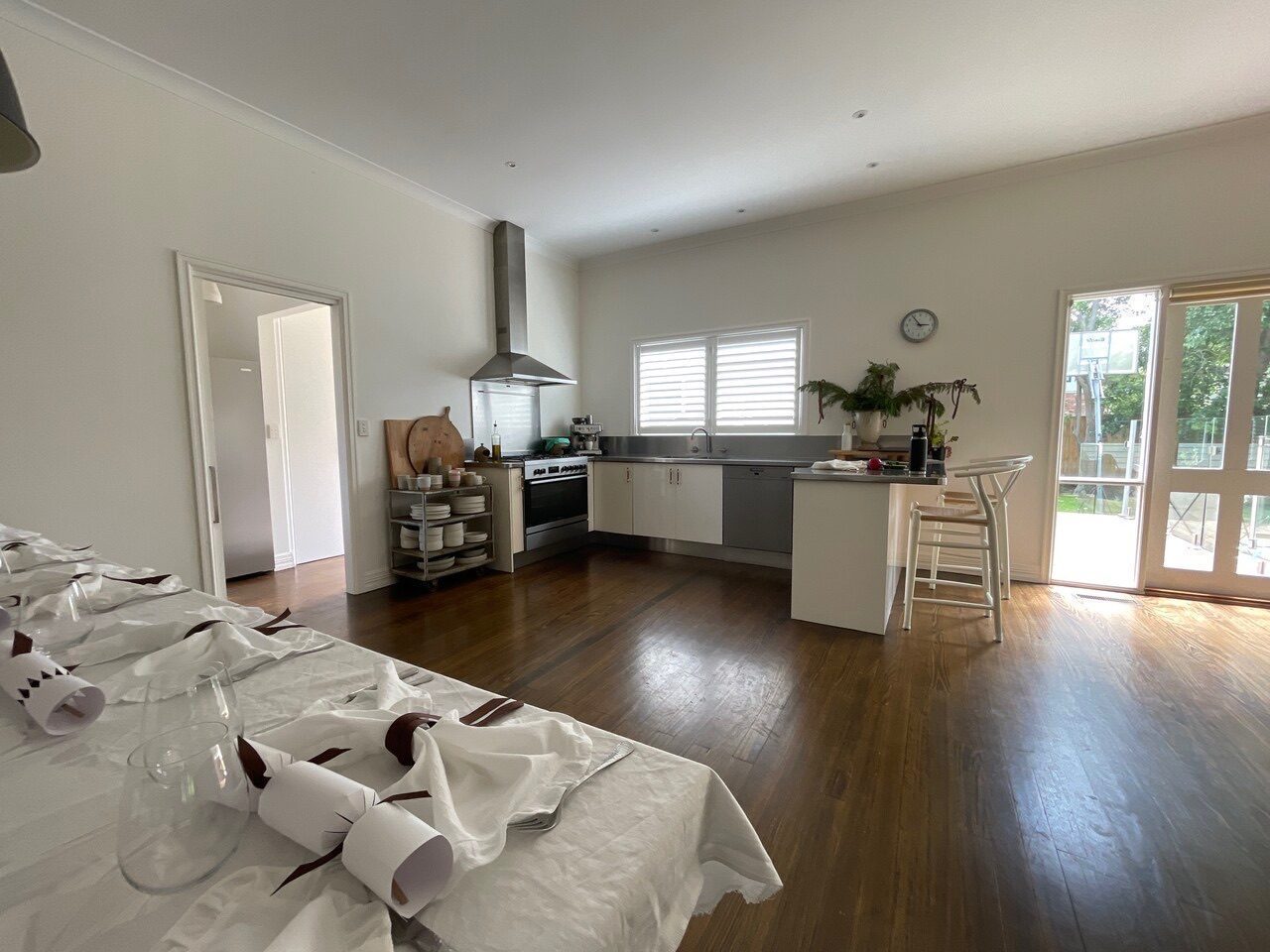 White plantation shutters fitted in a kitchen — Melbourne house