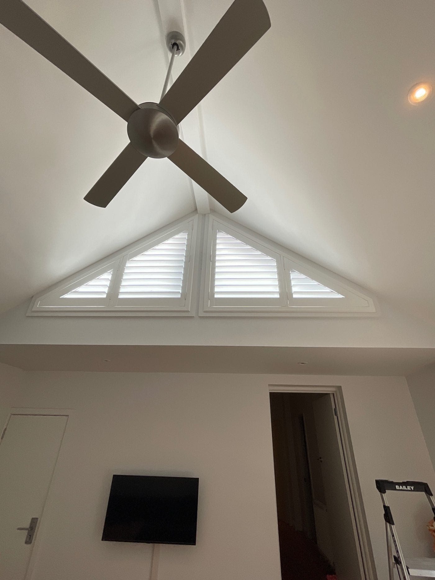 Neutral plantation shutters complementing a Melbourne living room décor