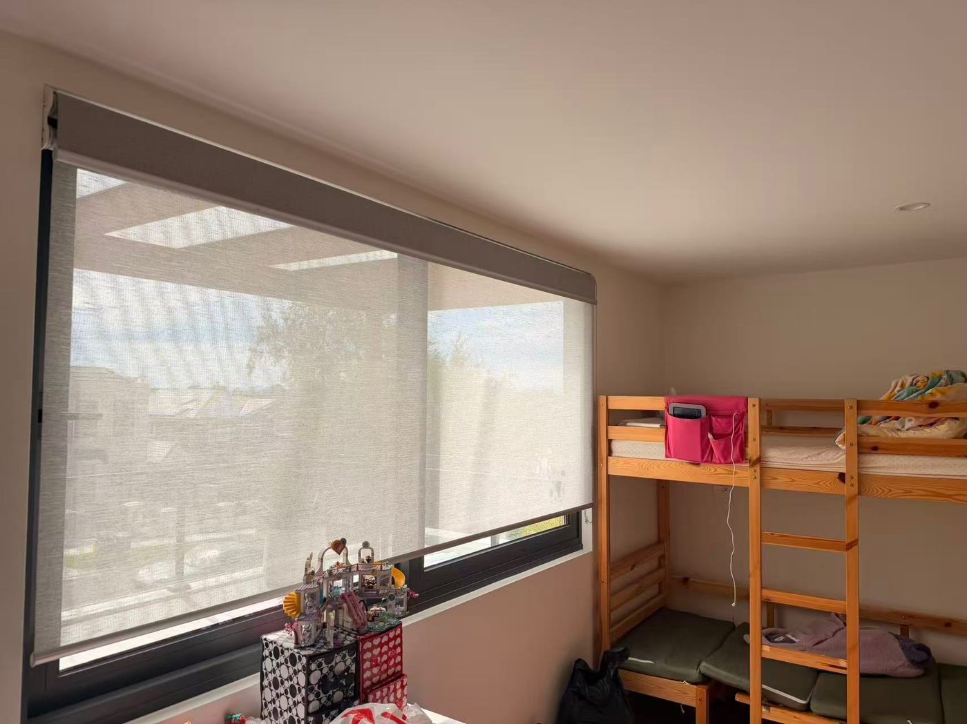 Roller blinds in a bedroom — Melbourne townhouse