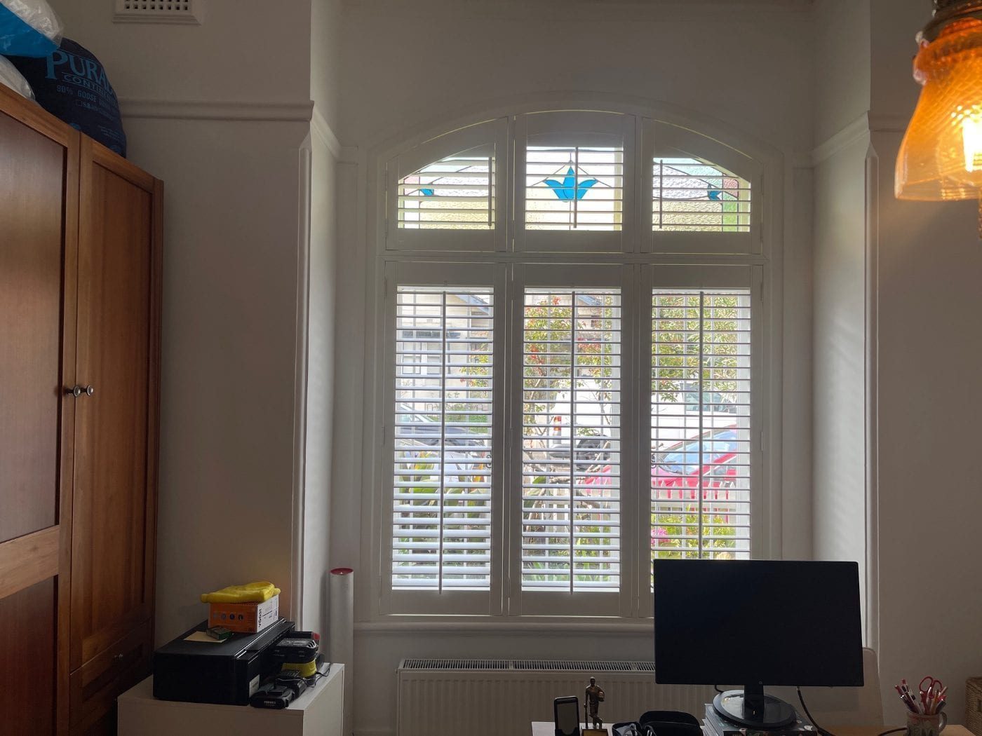 PVC plantation shutters for light control in a Melbourne bedroom