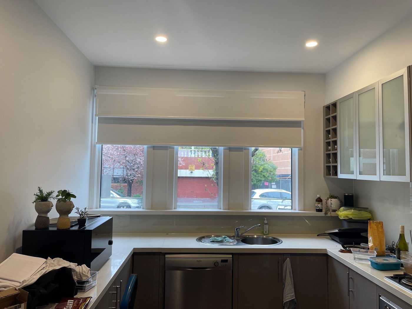 Roller blinds in a kitchen — contemporary Melbourne home