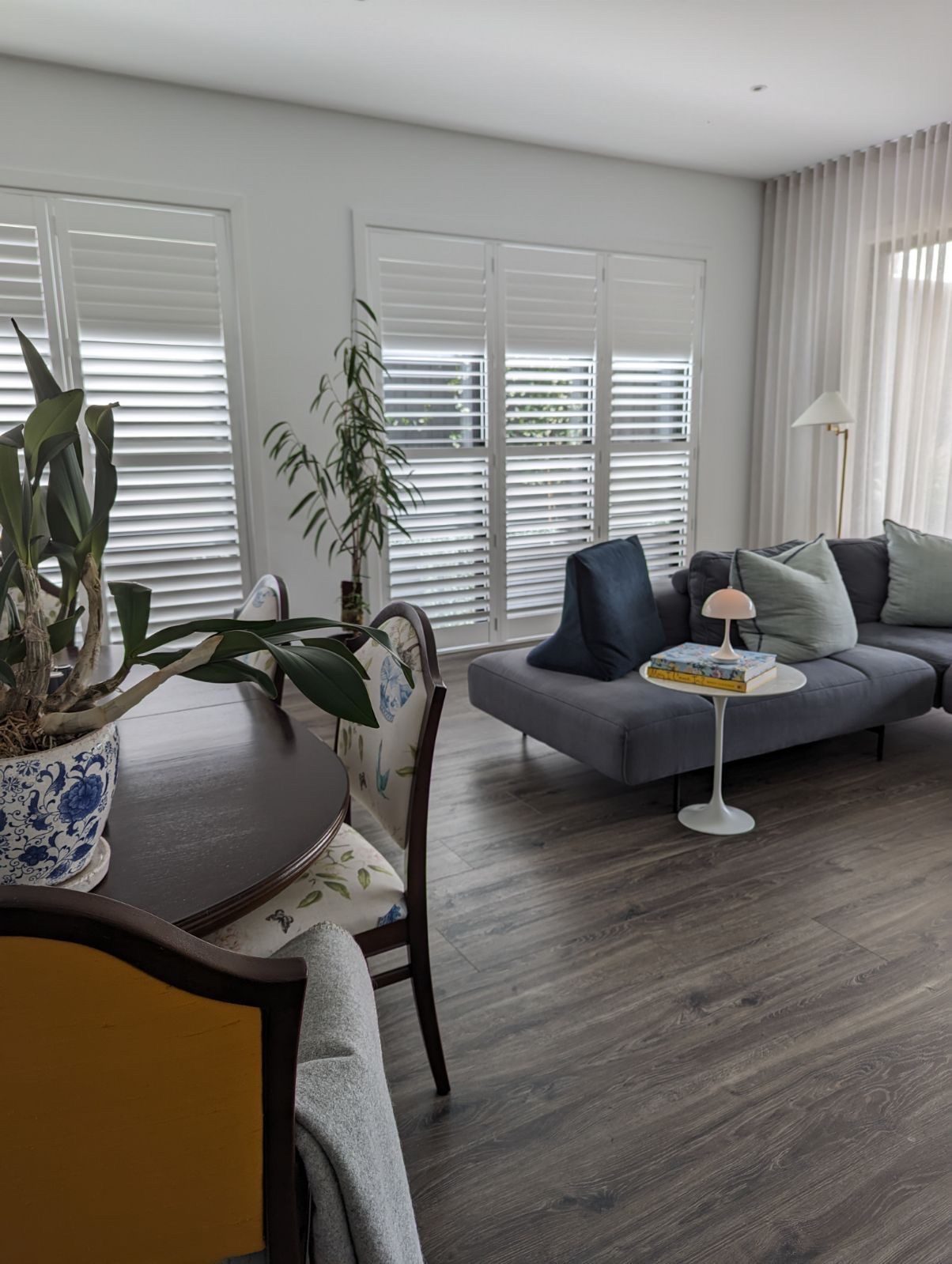Plantation shutters installed in a main living room — Melbourne home