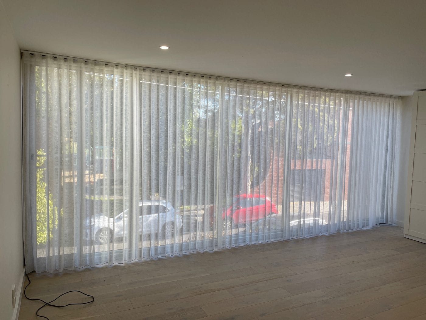Custom linen curtains in a serene Melbourne master bedroom