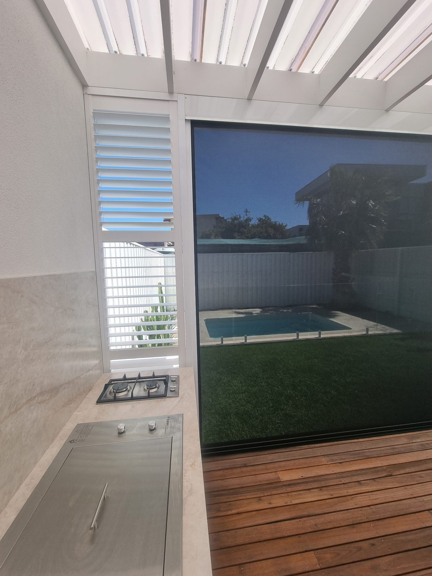 Custom aluminium shutters installed in a alfresco — Melbourne townhouse