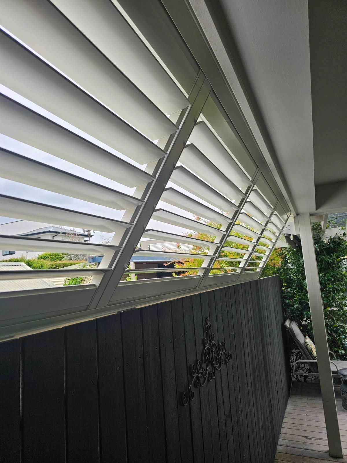 Aluminium shutters in a outdoor area — contemporary Melbourne home