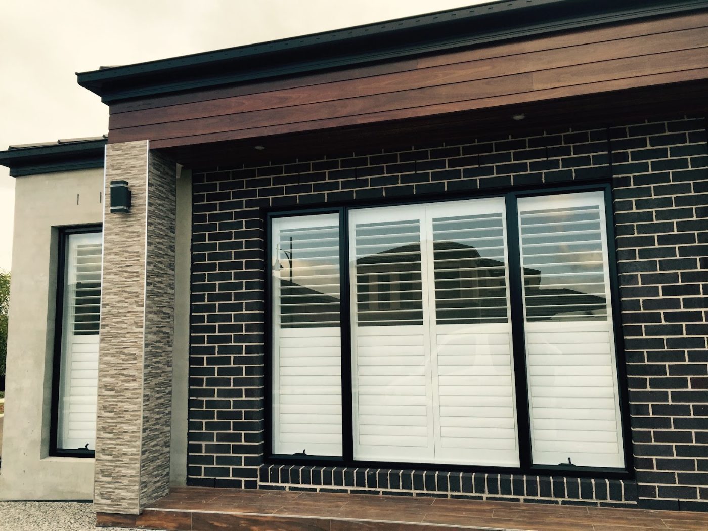 Plantation shutters with adjustable louvres on a Melbourne facade