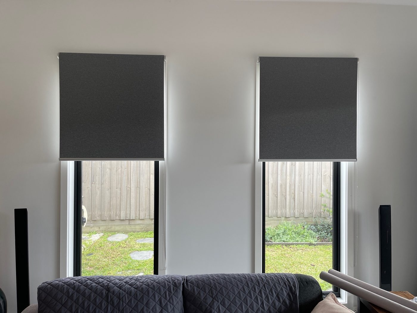Fabric roller blinds installed in a living room — contemporary Melbourne home