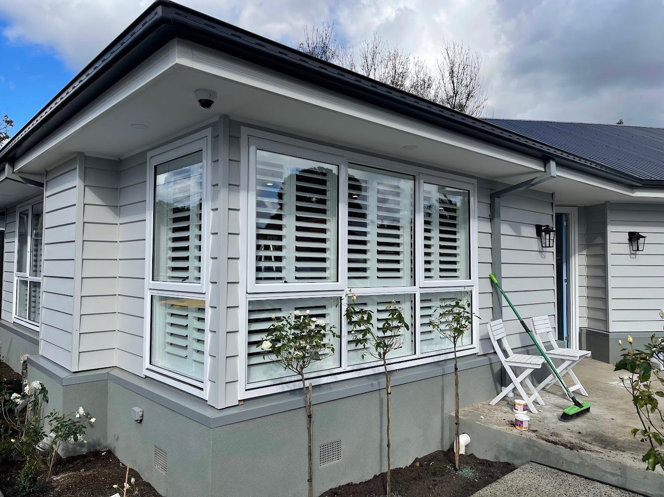 Elegant plantation shutters on the front windows of a Melbourne home
