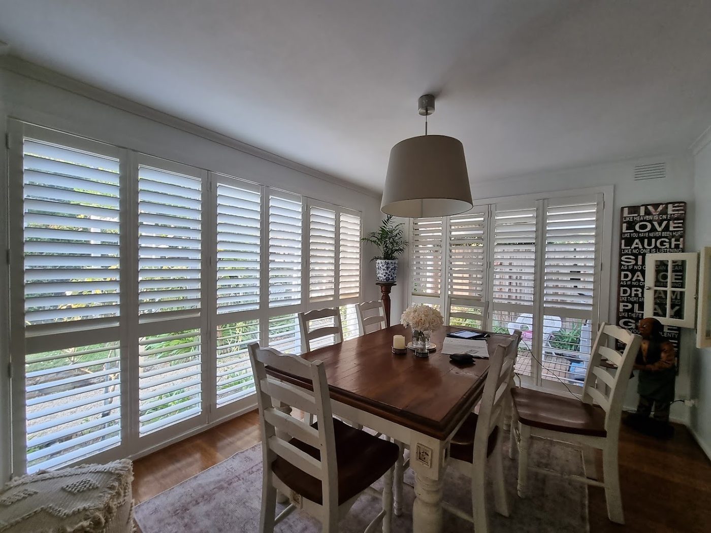 Plantation shutters in a dining room — modern Melbourne home