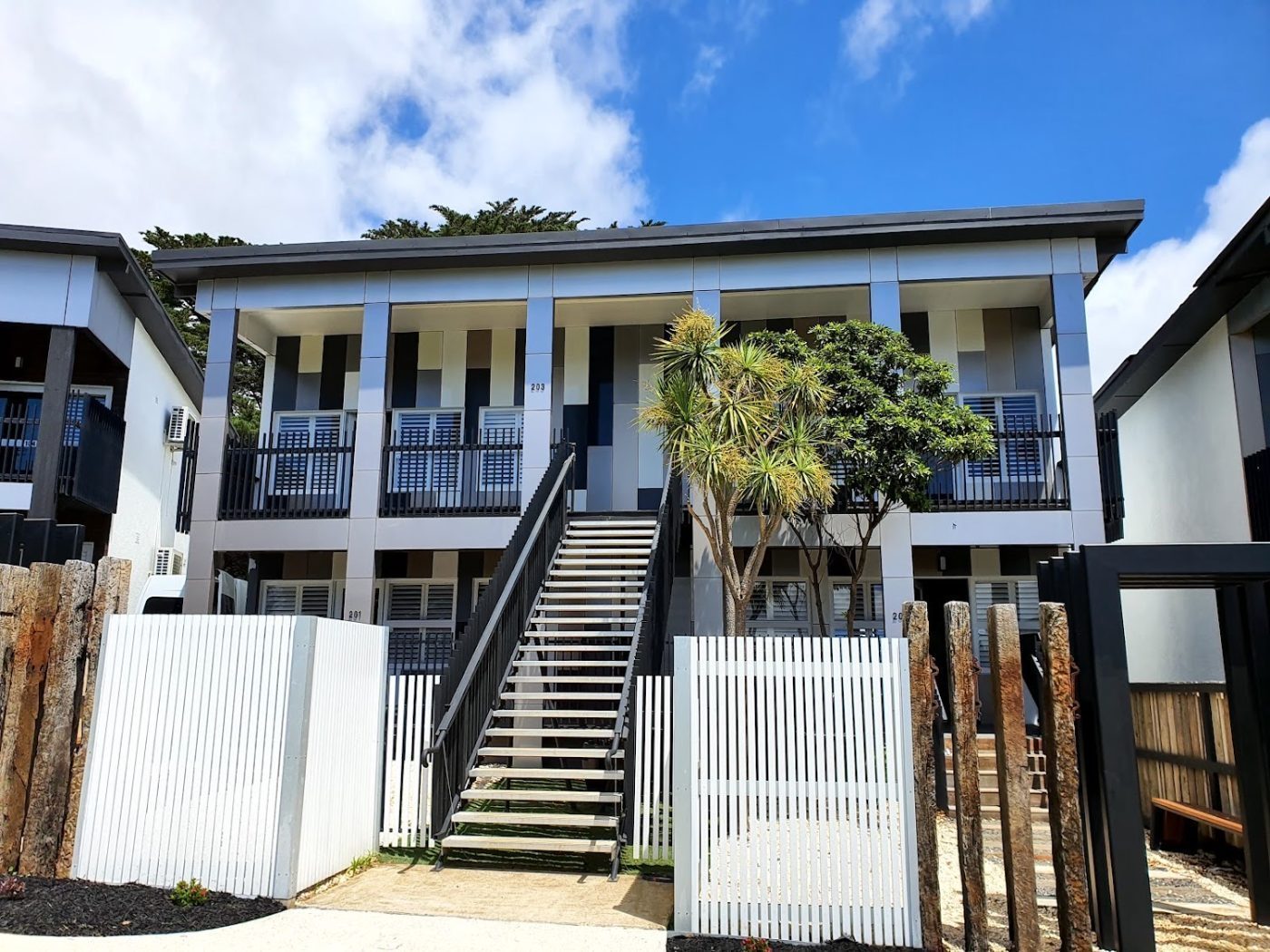 Painted white plantation shutters on outdoor windows, Melbourne