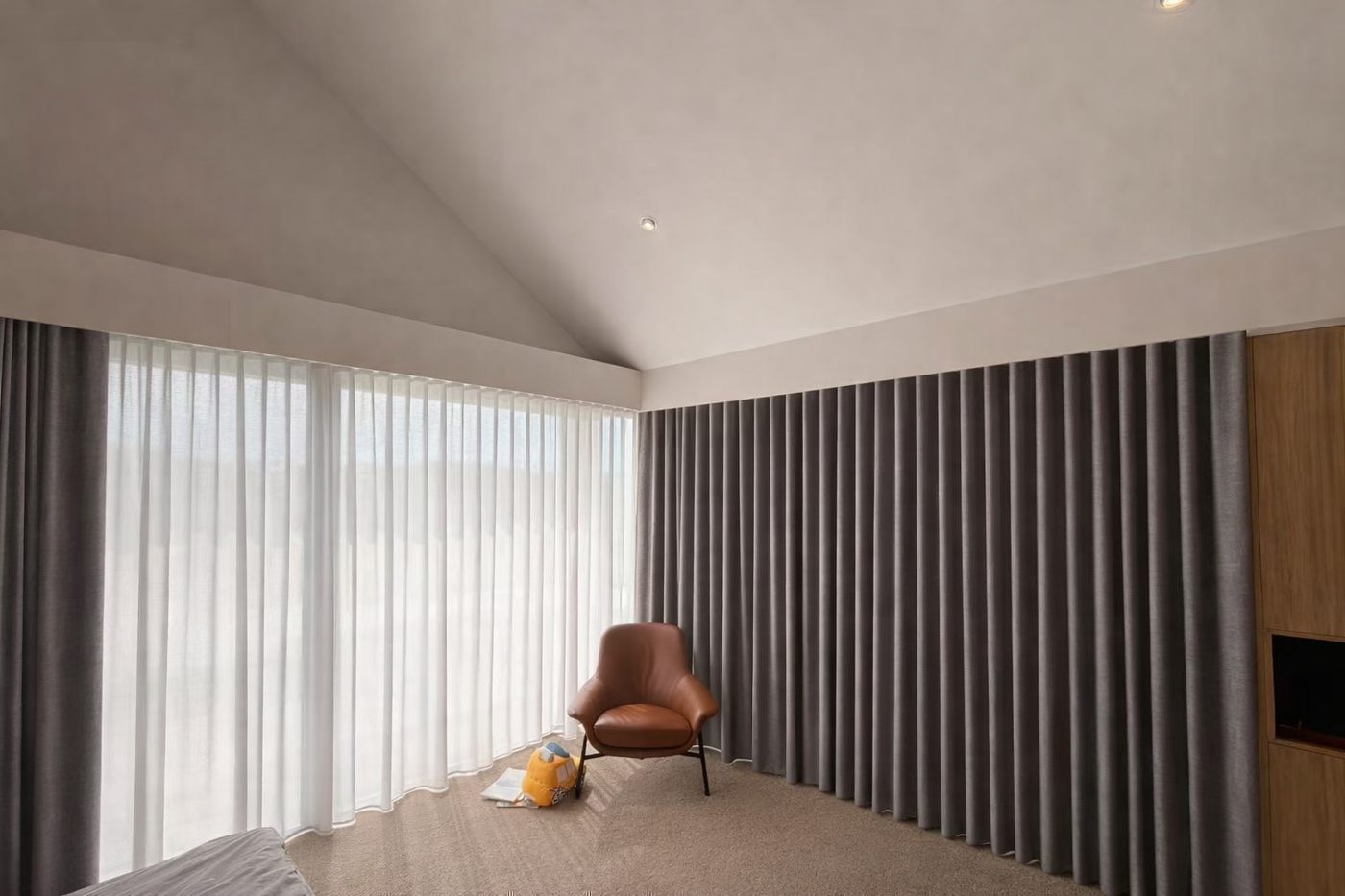 Curtains and motorised blinds in a bedroom — Melbourne townhouse