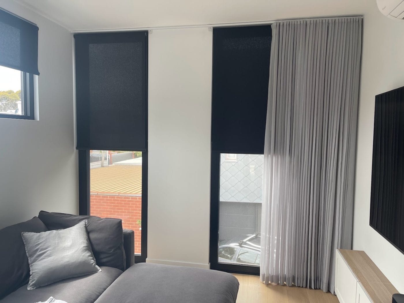 We Inspire curtain and roller blind combination in a Melbourne living room