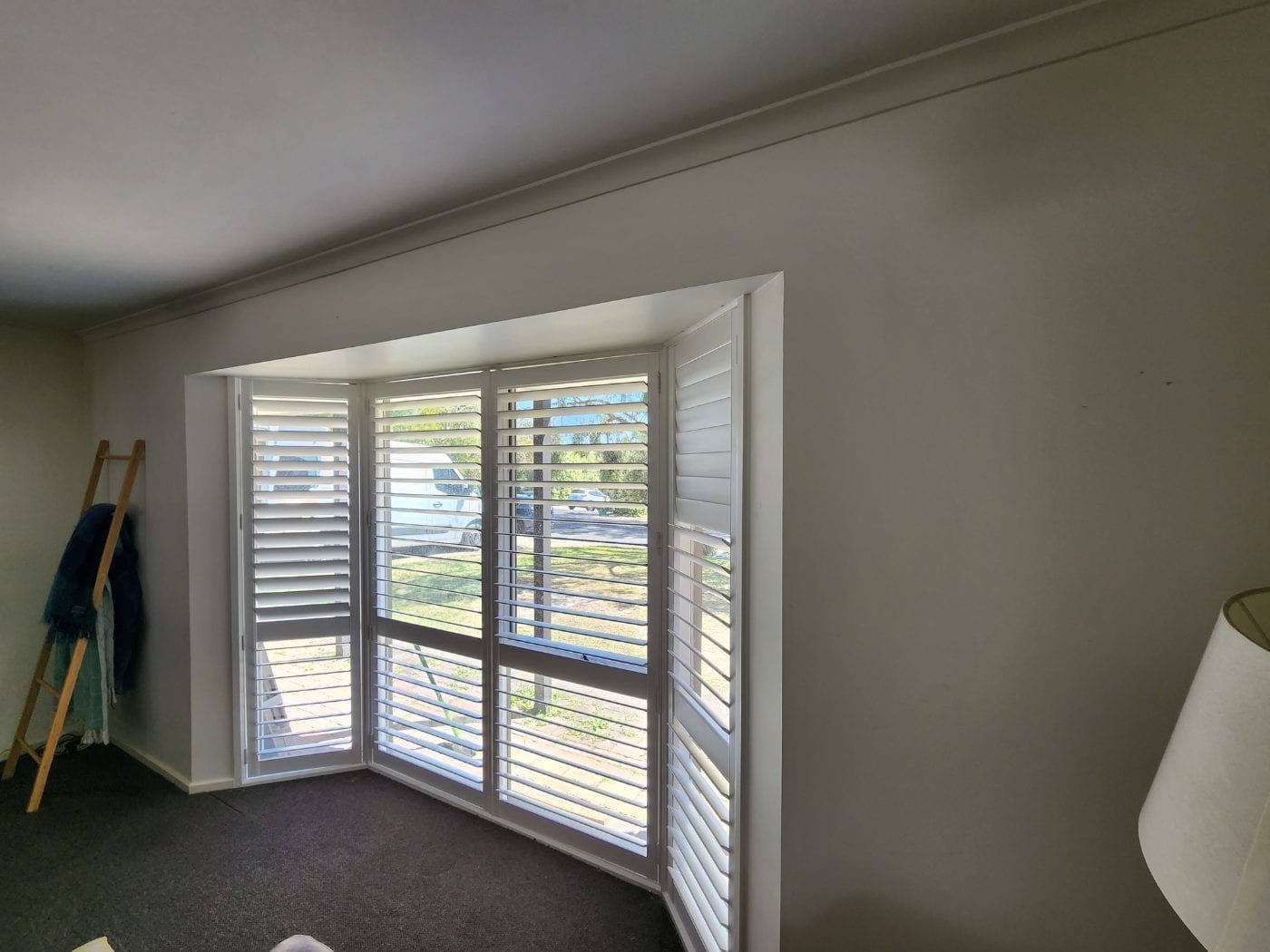 Hamptons-style plantation shutters in a Melbourne living room