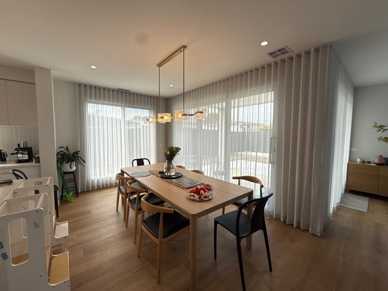 Roller blinds and curtains in a living room — Melbourne townhouse