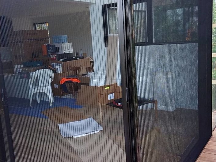 Retractable insect screens fitted in a open-plan living area — Melbourne townhouse