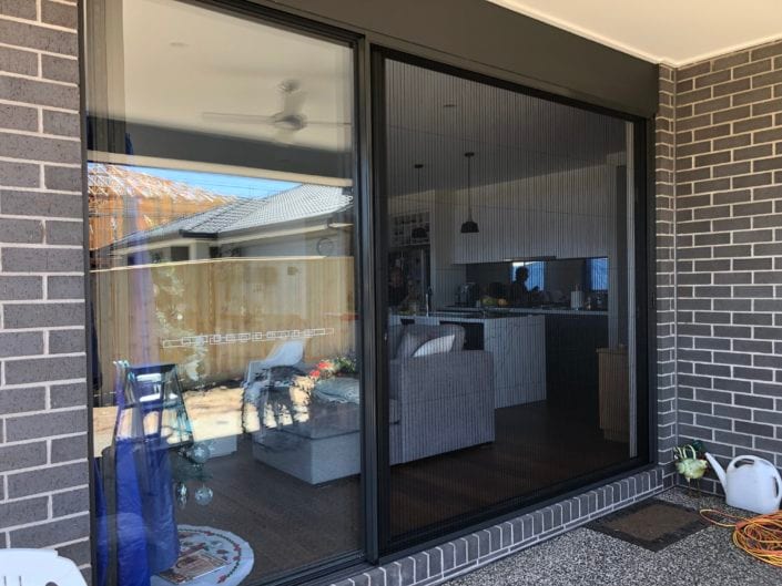 Retractable fly screens in a outdoor area — Melbourne townhouse