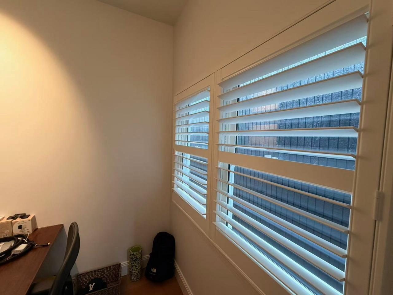 Plantation shutters in a home office — Melbourne apartment