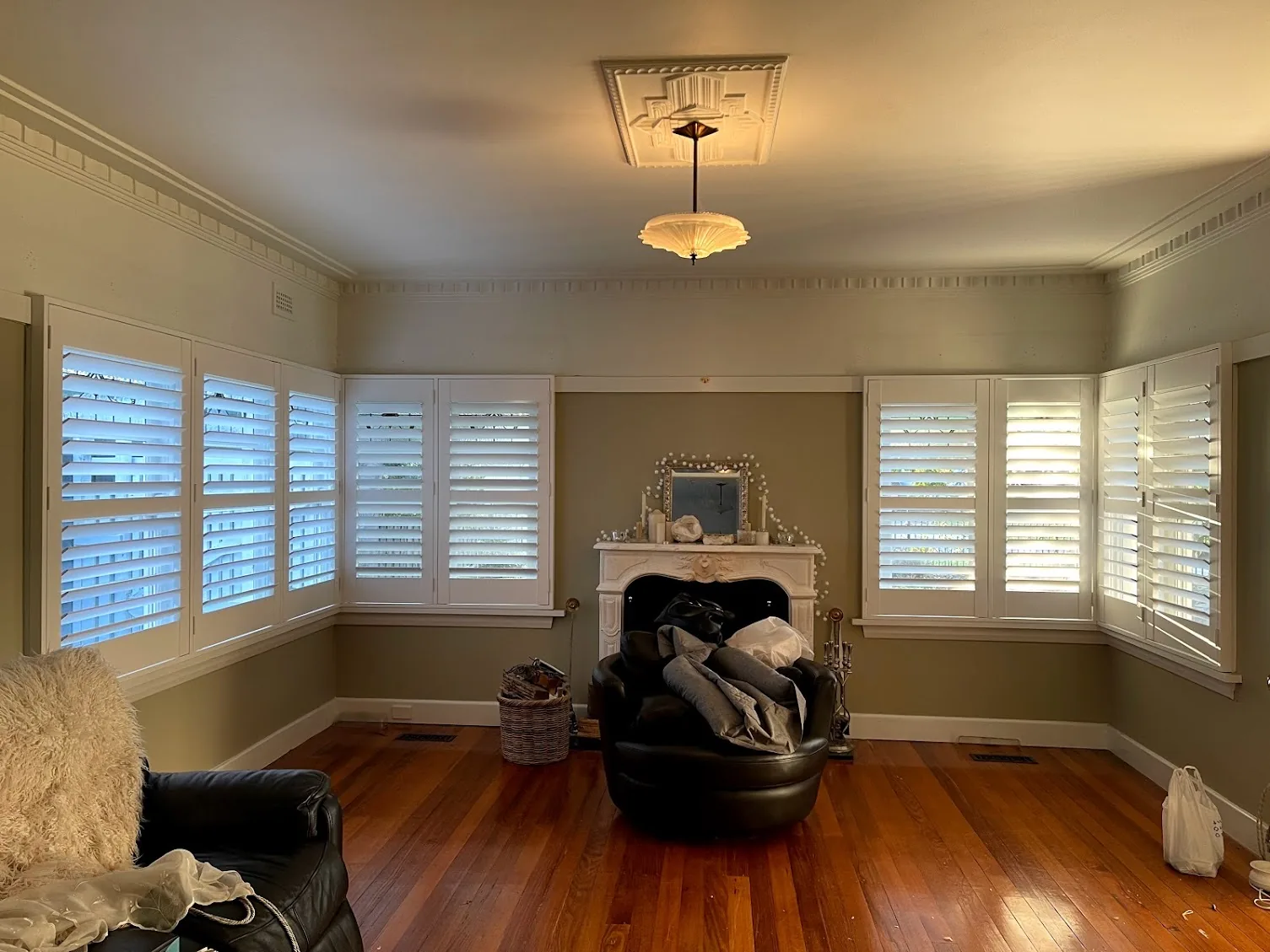 Plantation shutters installed on corner windows in a Melbourne home — We Inspire Blinds