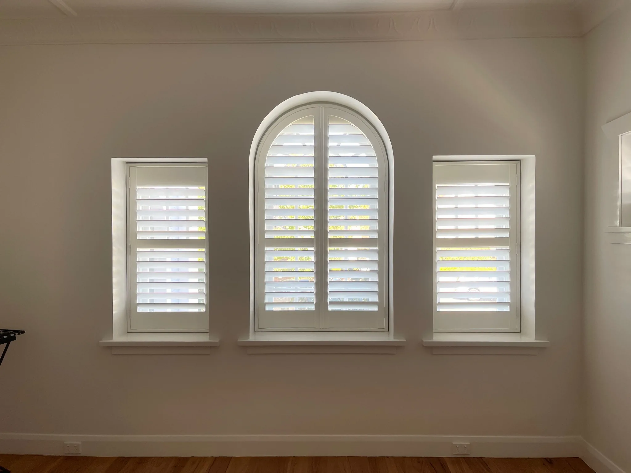 Custom plantation shutters for arched windows in Melbourne home — We Inspire Blinds