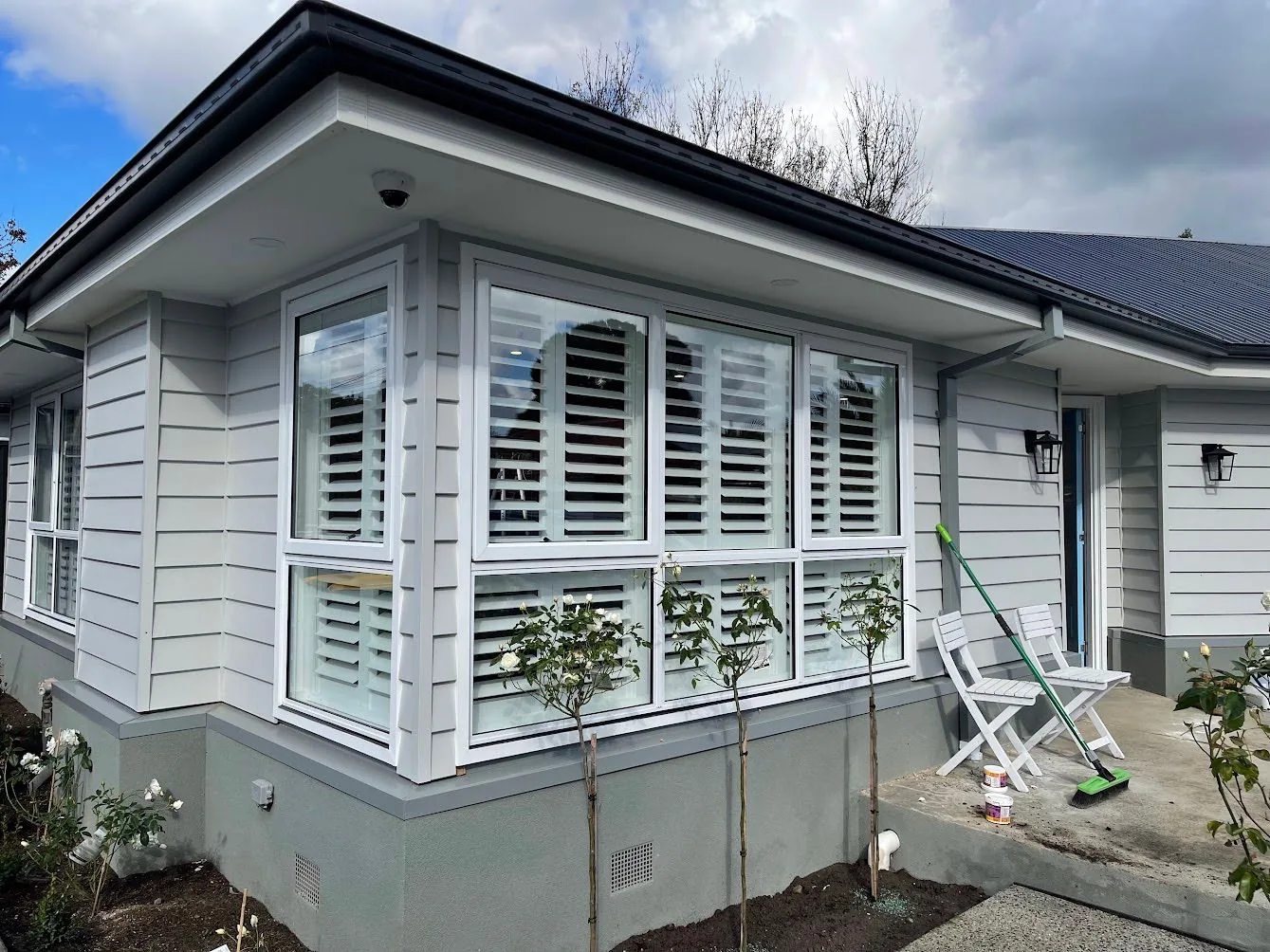 Plantation shutters installed on street facing front windows of a Melbourne home — We Inspire Blinds