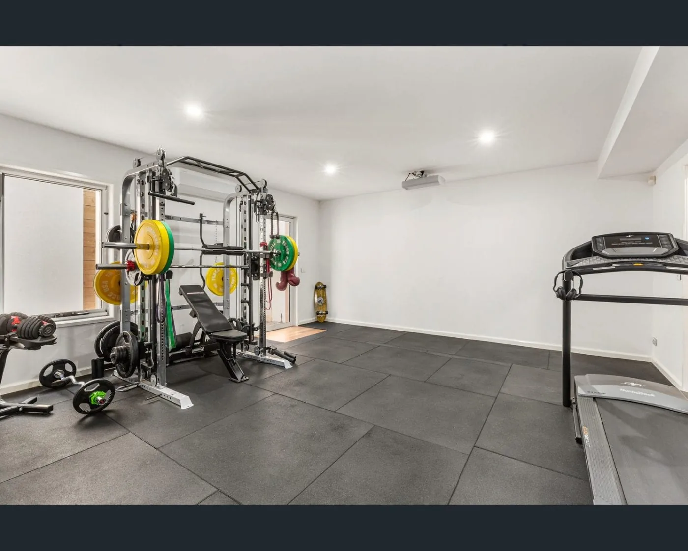 Motorised roller blinds in basement gym Melbourne